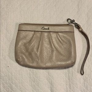 Champagne coach wristlet